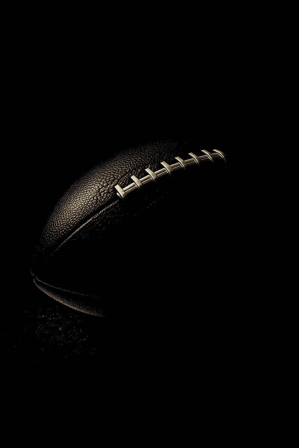 NFL_20250626_0230_Dramatic_Football_Spotlight_simple_compose_01jymkbsq1e2h89a3hpahgb25c.png